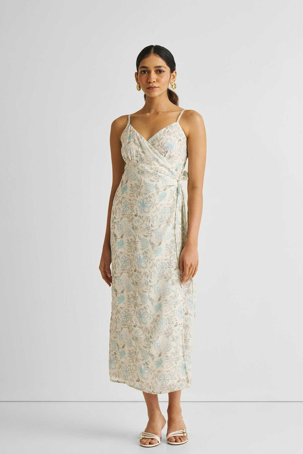 Strappy wrap midi dress with blue floral print, adjustable tie waist, thin straps