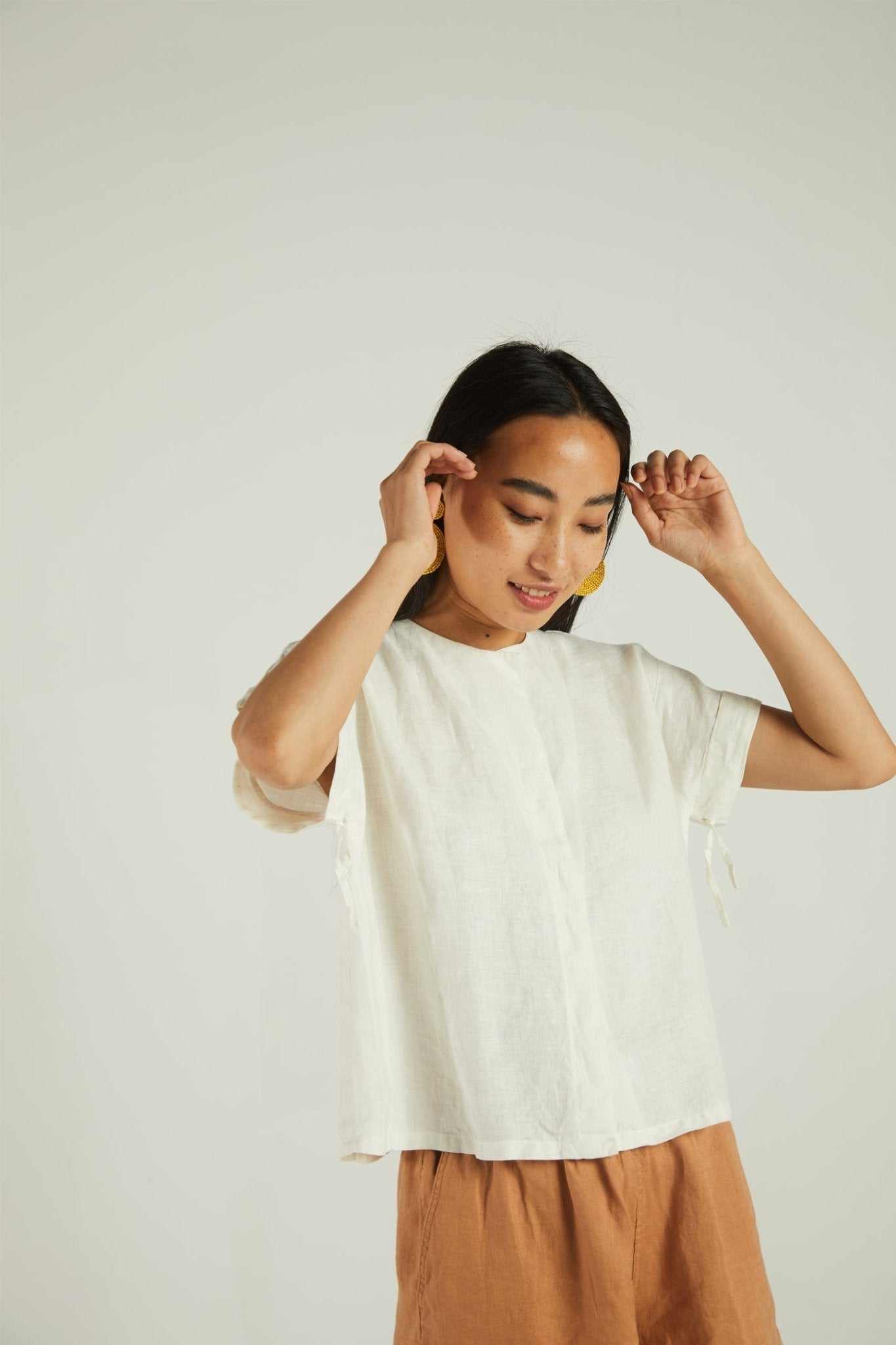 The Daydreams Shirt, shell off-white: relaxed short-sleeve blouse with side tassels