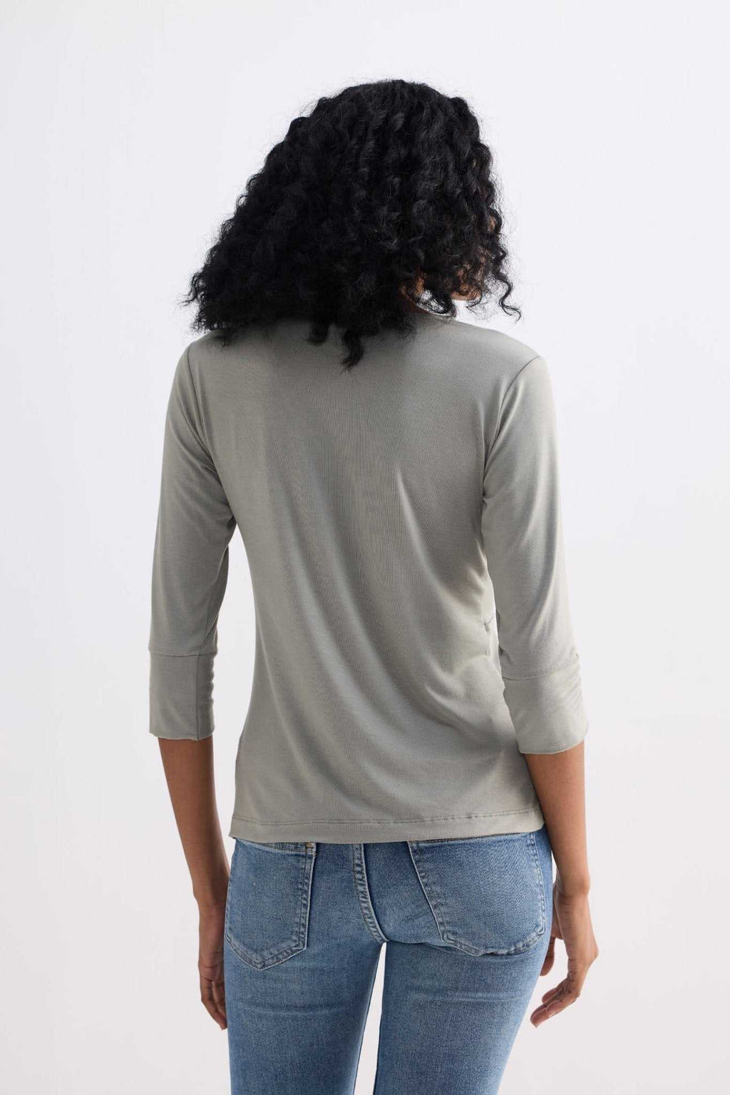 Light olive knit twist-front shirt, back view, three-quarter sleeves