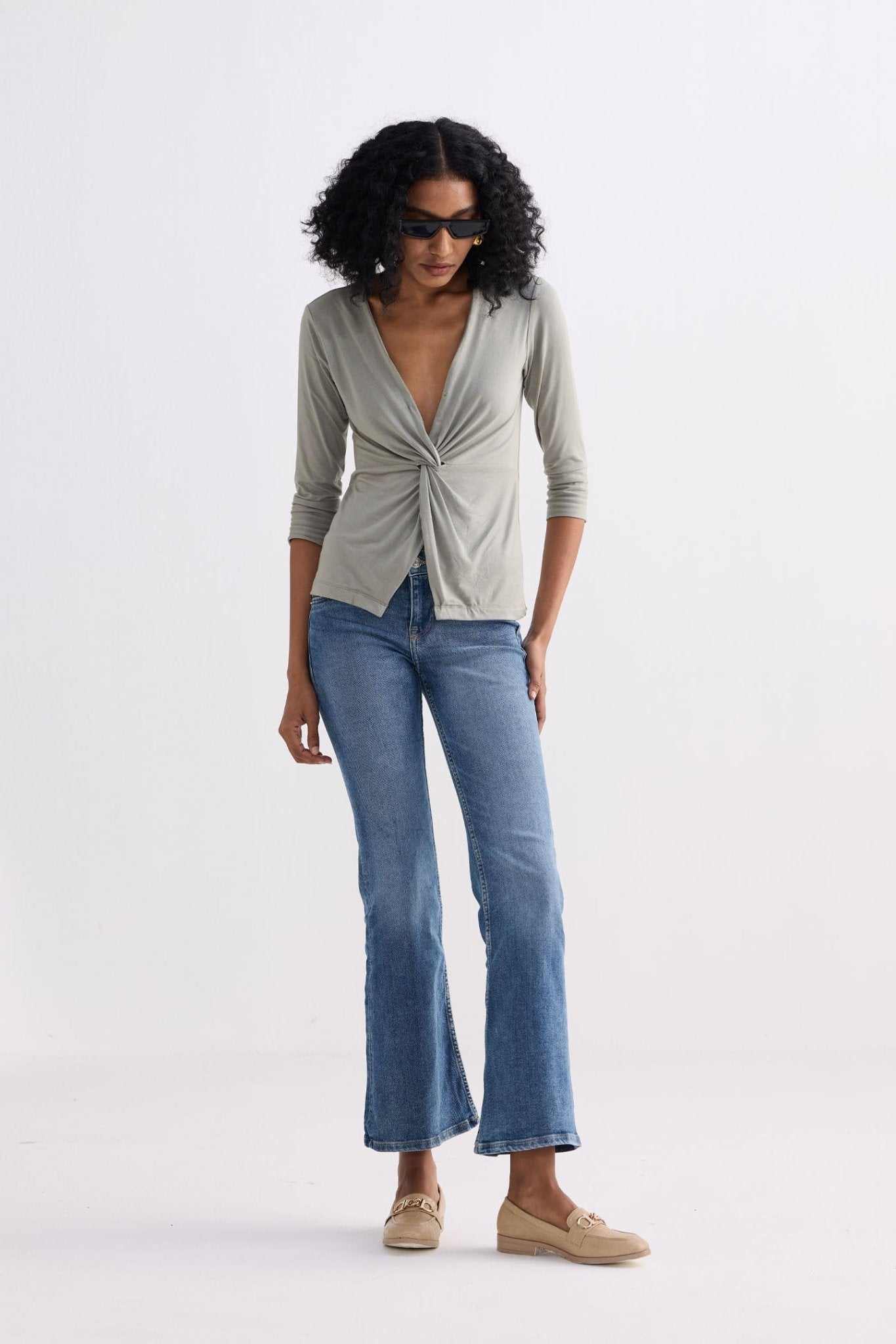 Light olive twist-front knit shirt, V-neck with center knot detail